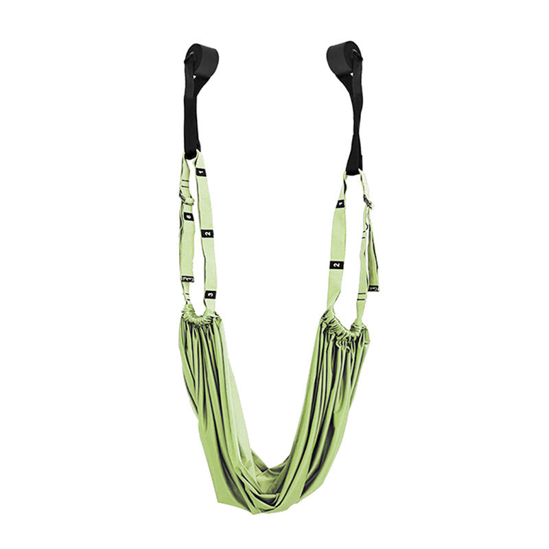 Yoga stretch strap hanging from a door