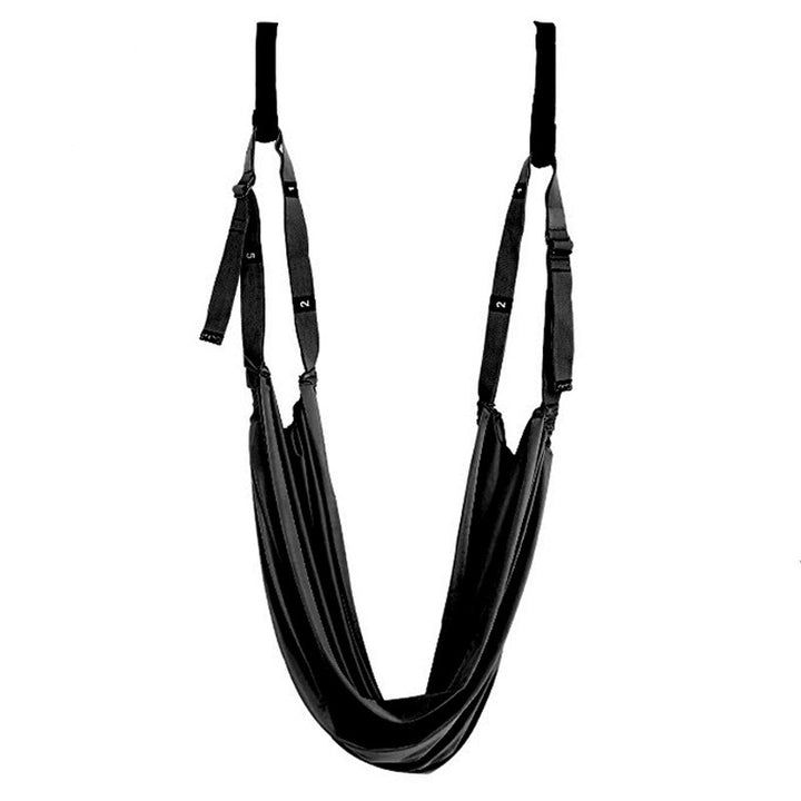 Yoga stretch strap hanging from a door